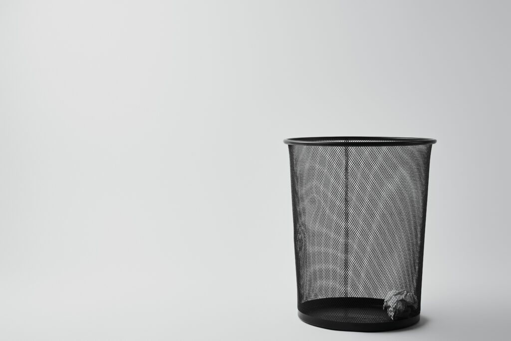 Video 8 office trash bin with crumpled paper on white 2024 11 18 13 19 03 utc